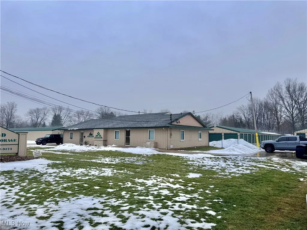 View of front of property with a lawn