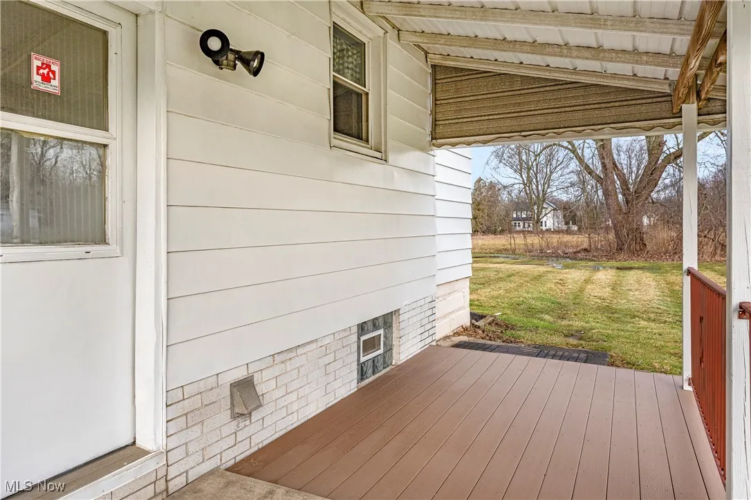 Deck featuring a yard