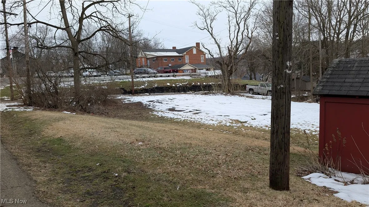 View of yard covered in snow