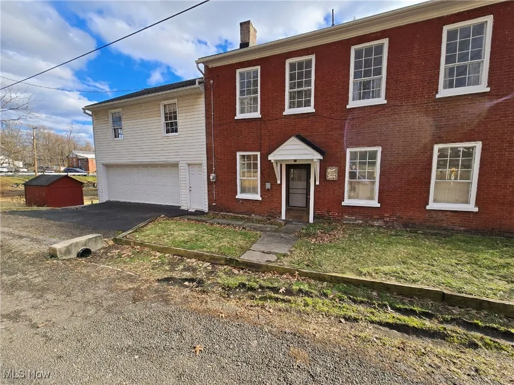 View of front facade featuring a garage