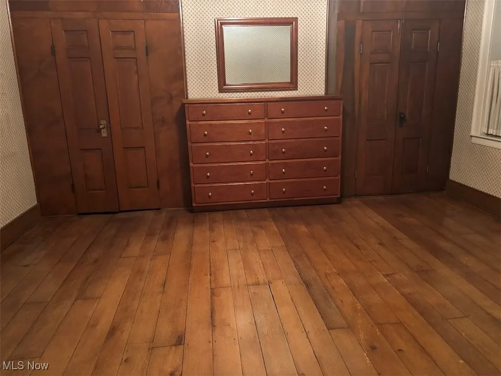Unfurnished bedroom with light wood-type flooring