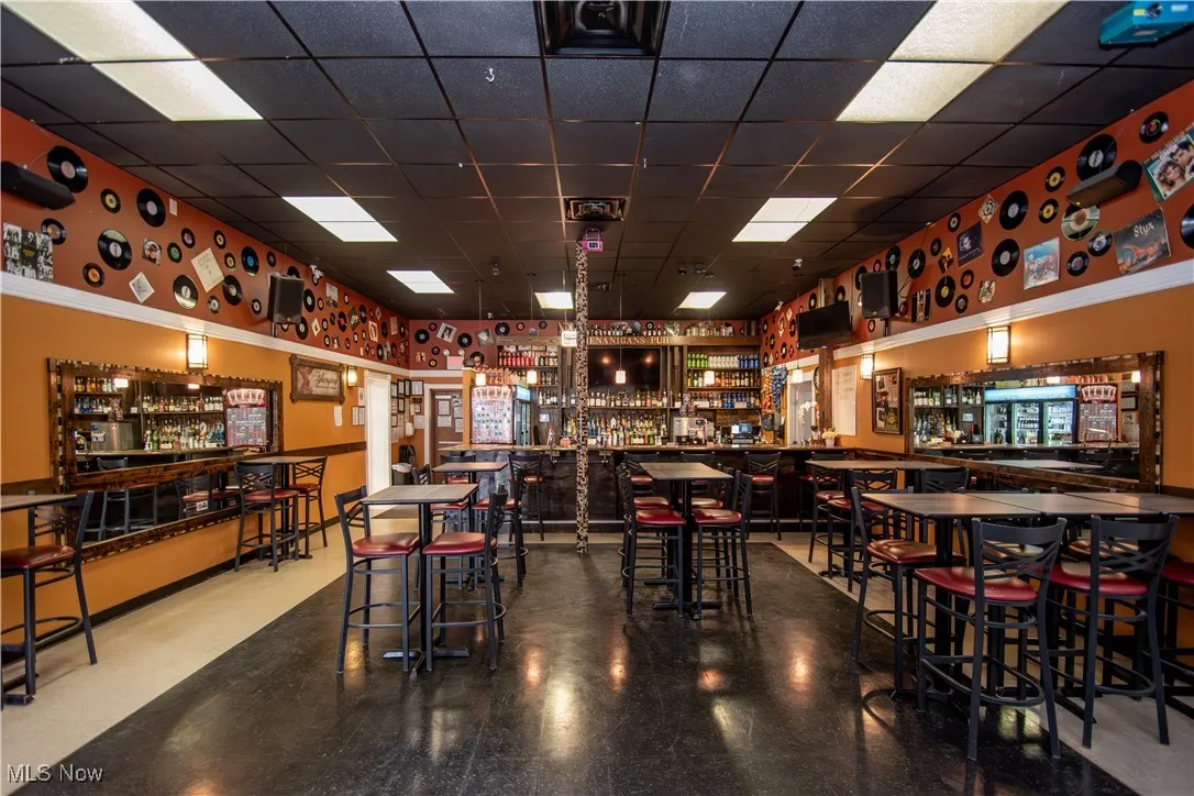 Bar featuring a paneled ceiling