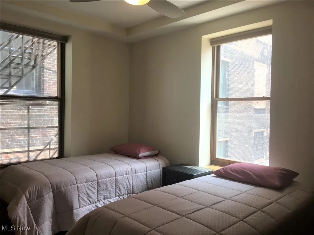 Bedroom featuring multiple windows