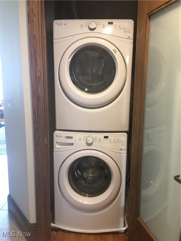 Laundry room featuring stacked washer / drying machine