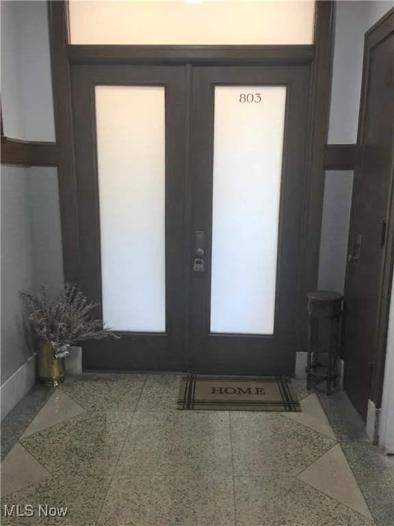 Entryway featuring french​​‌​​​​‌​​‌‌​‌‌​​​‌‌​‌​‌​‌​​​‌​​ doors