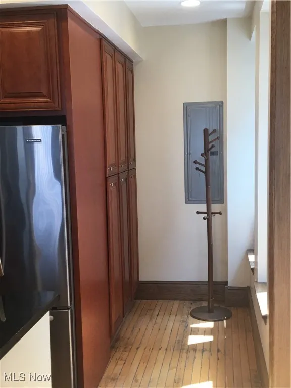 Hallway with wood-type flooring