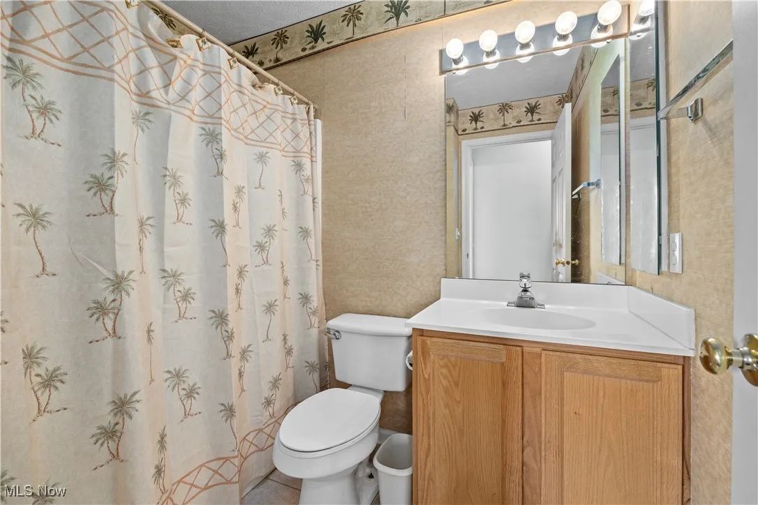 Bathroom with vanity and toilet