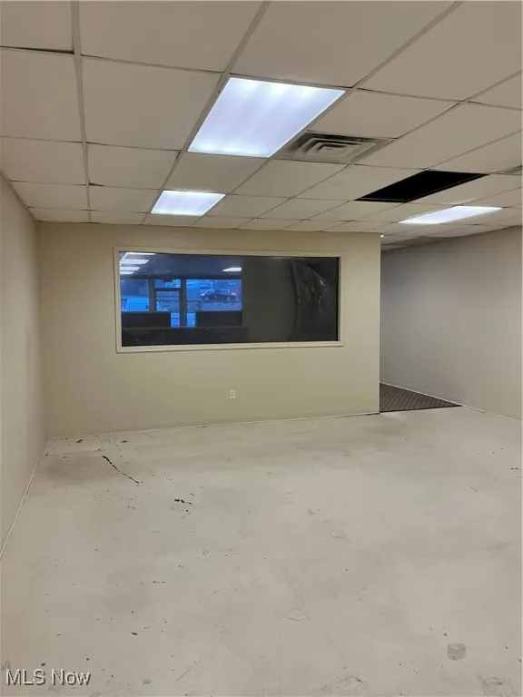 Basement with a paneled ceiling