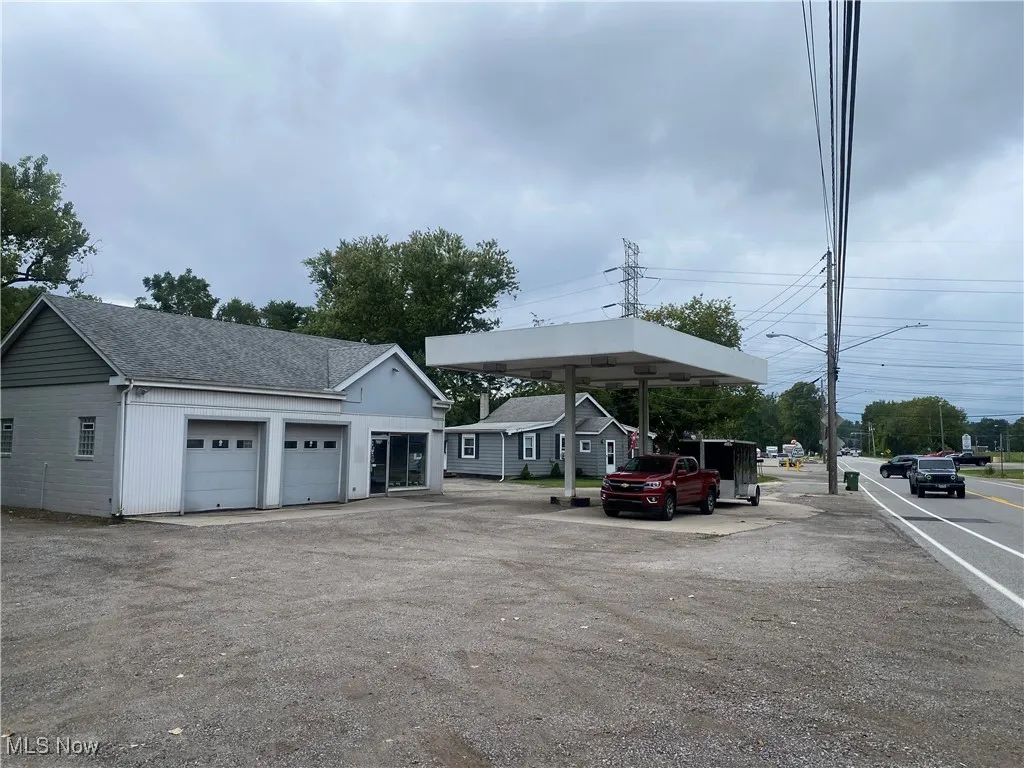 View of front of house with garage and carport