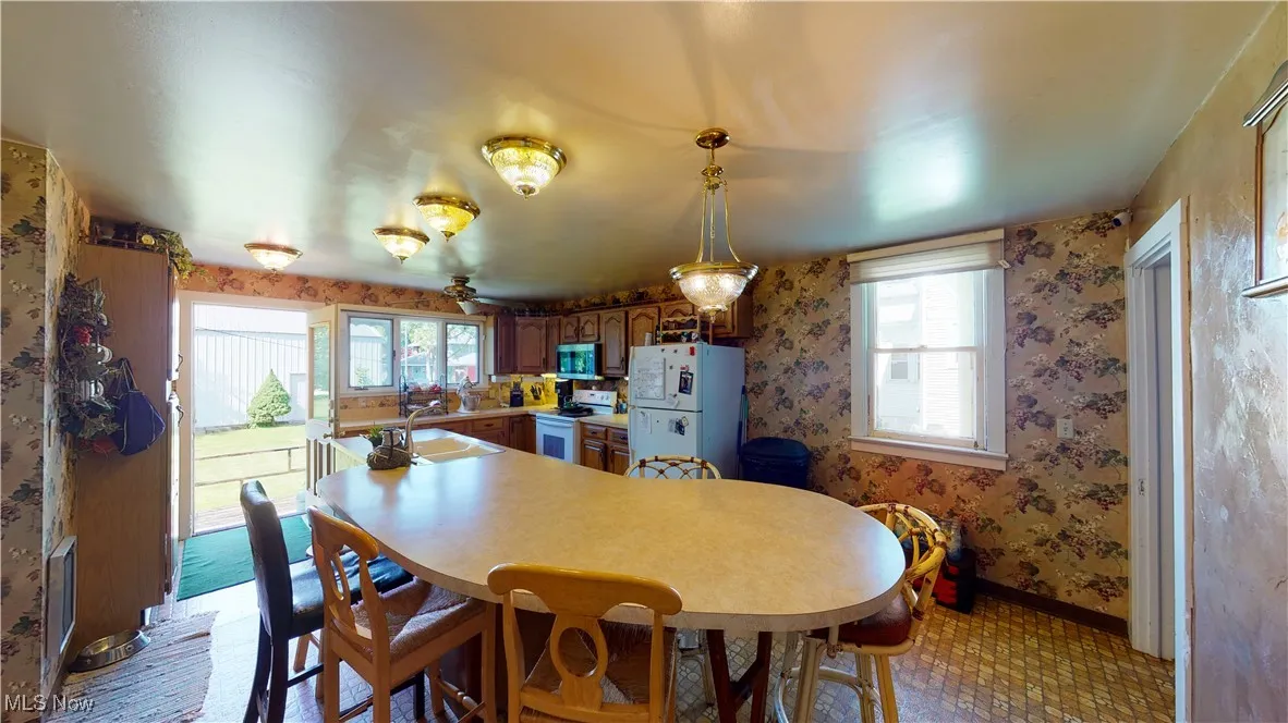 Dining area with a healthy amount of sunlight and sink