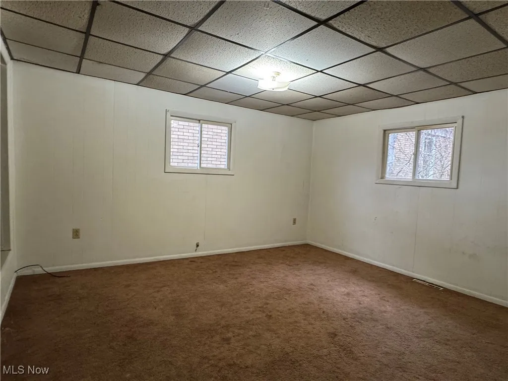 2nd floor basement featuring a drop ceiling and carpet floors
