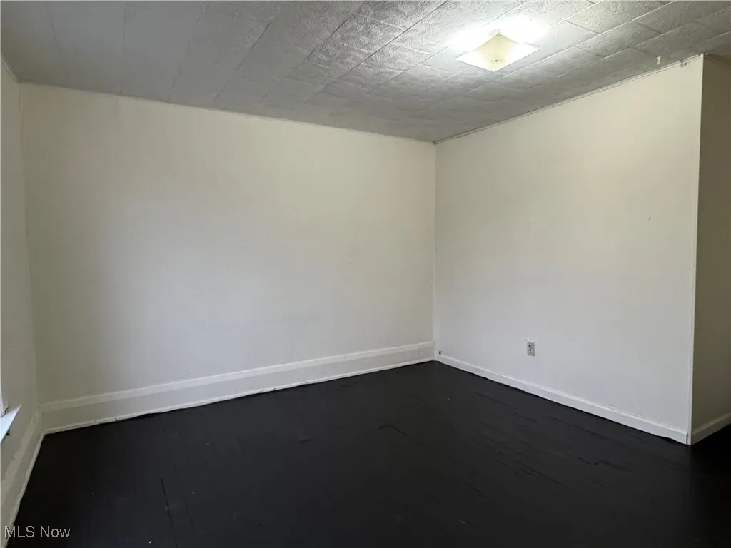 2nd floor Unfurnished bedroom with dark hardwood / wood-style floors