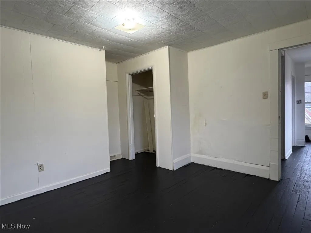 2nd floor nfurnished bedroom with dark hardwood / wood-style floors