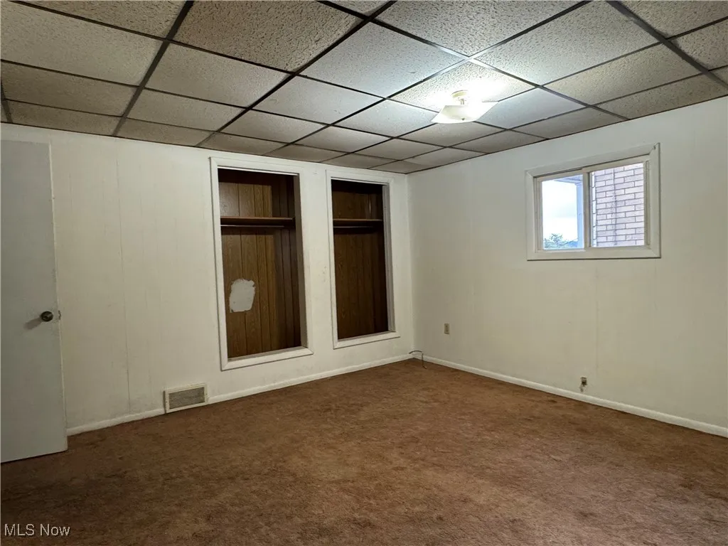 2nd floor bedroom carpet floors and a drop ceiling