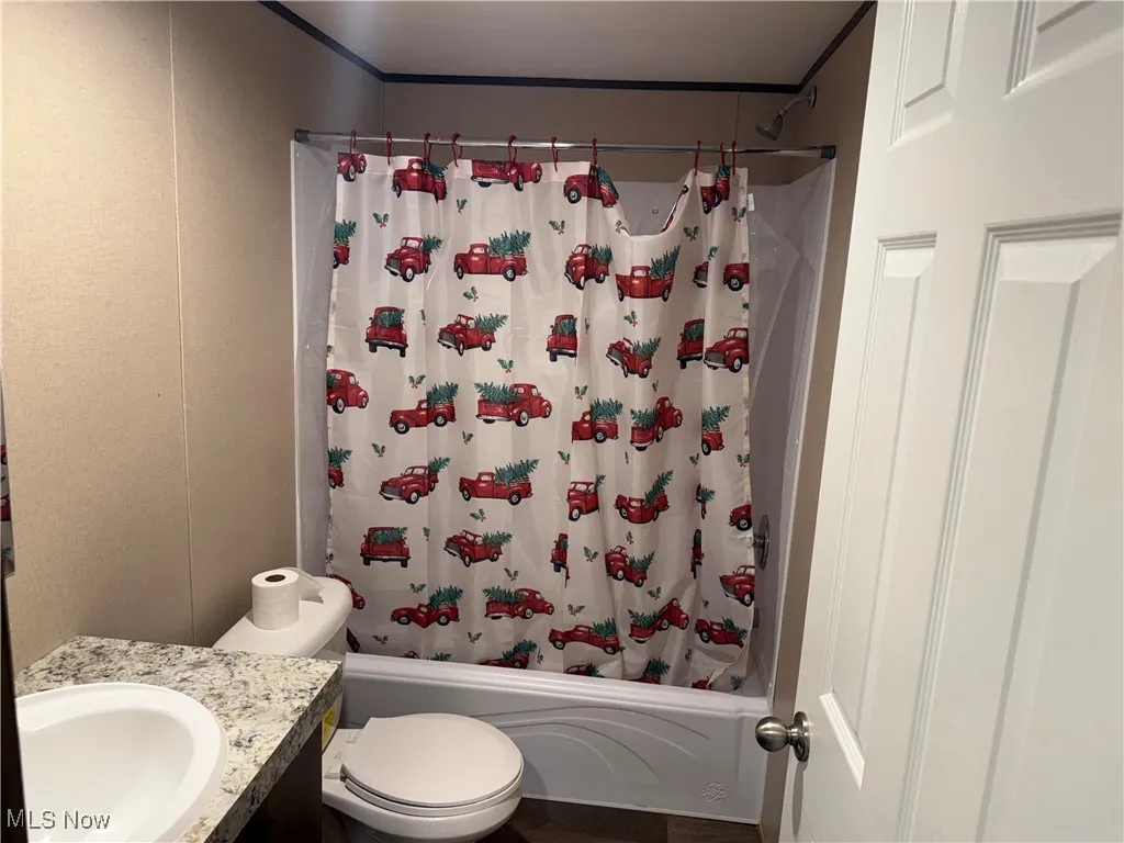 Bathroom with vanity and shower / bath combo