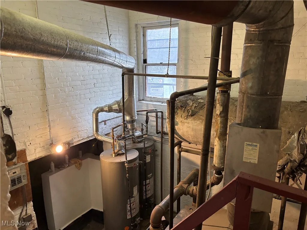 Utility room with gas water heater