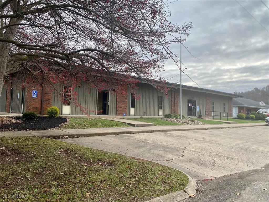 Front view of office building with parking.