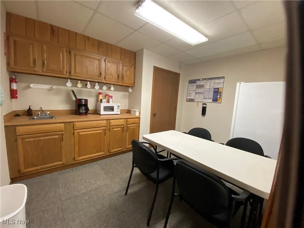 Breakroom with sink and storage.