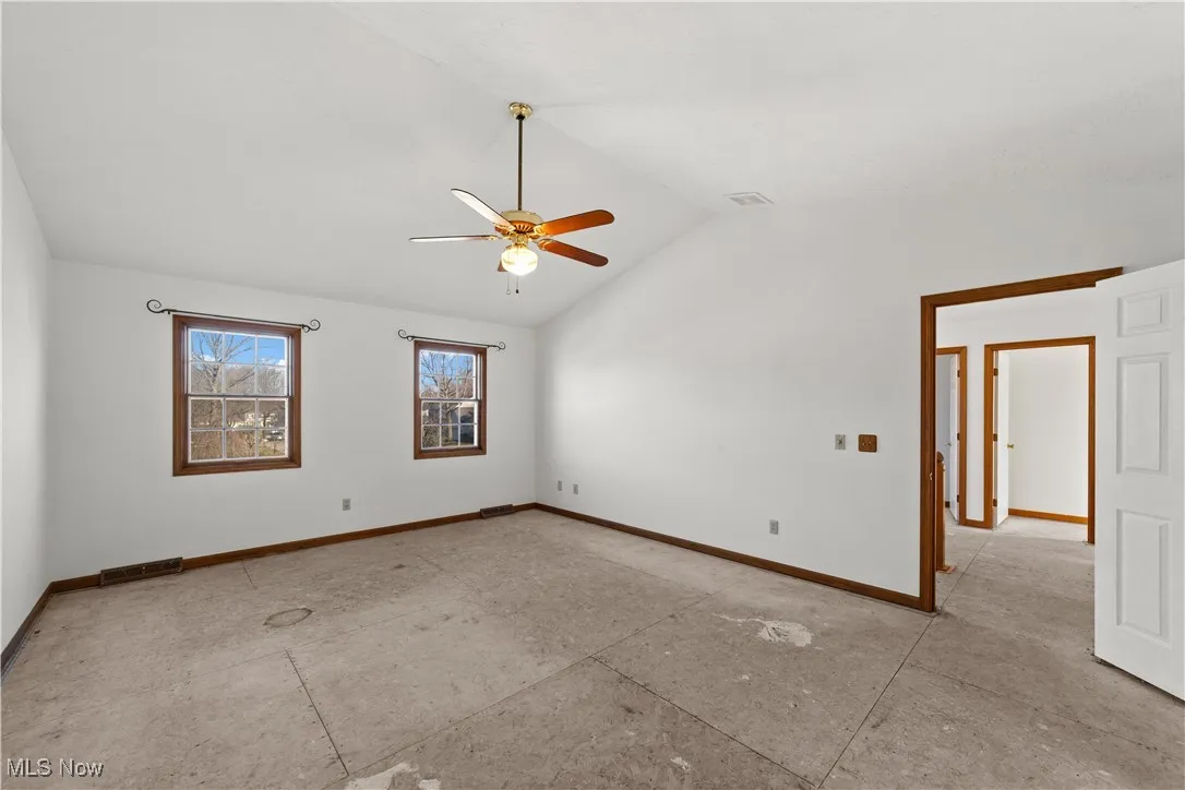 Large bedroom with Cathedral Ceiling and ceiling Fan