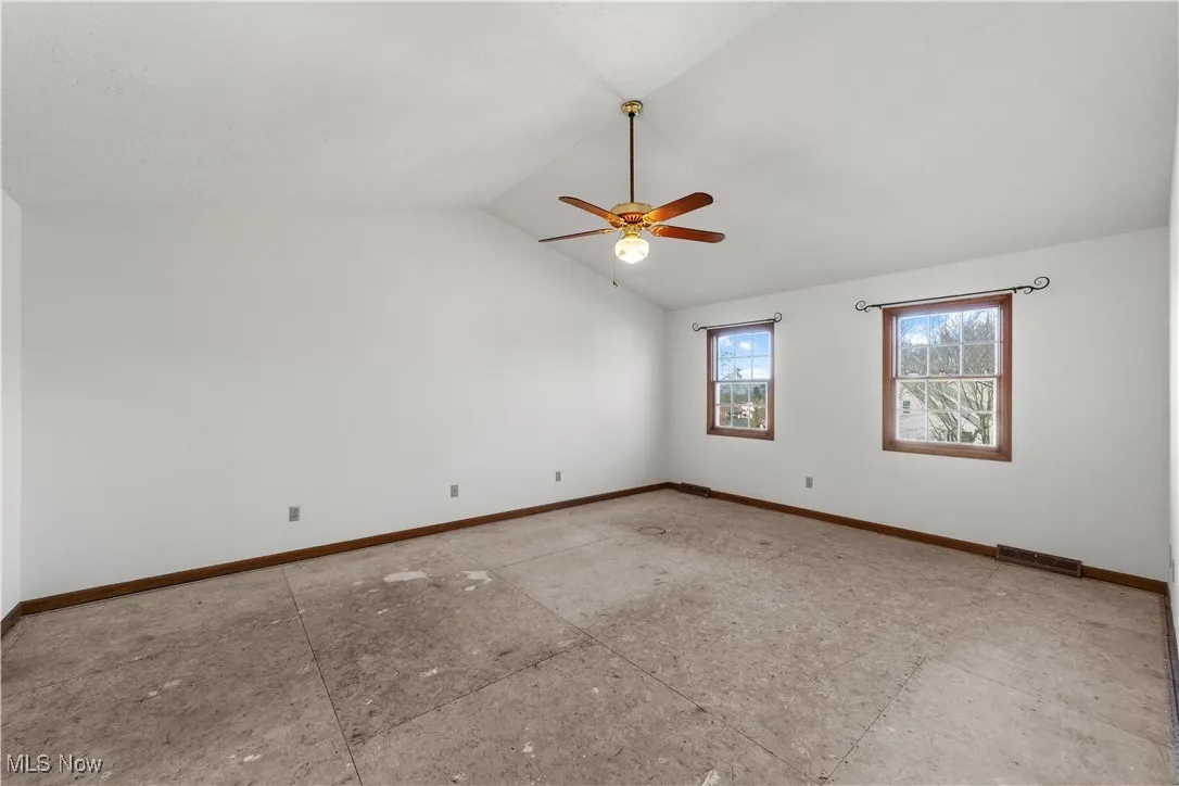 Large bedroom with Cathedral Ceiling and ceiling Fan