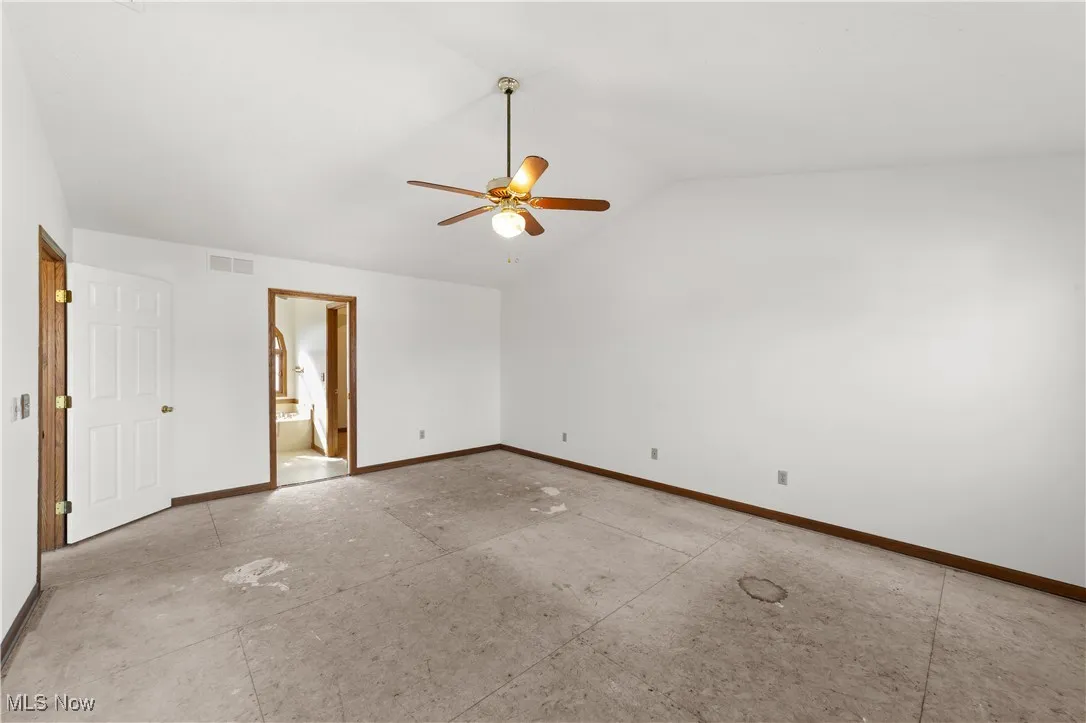 2nd floor bedroom freshly painted with ceiling fan