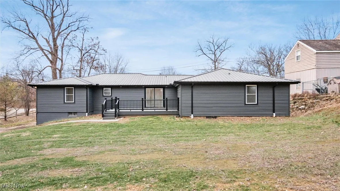 Rear view of house with a deck