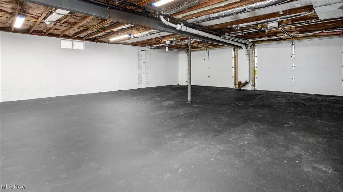 View of garage with electric garage door openers