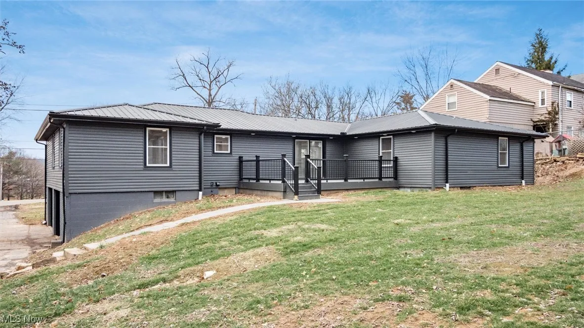 Rear view of property with a deck