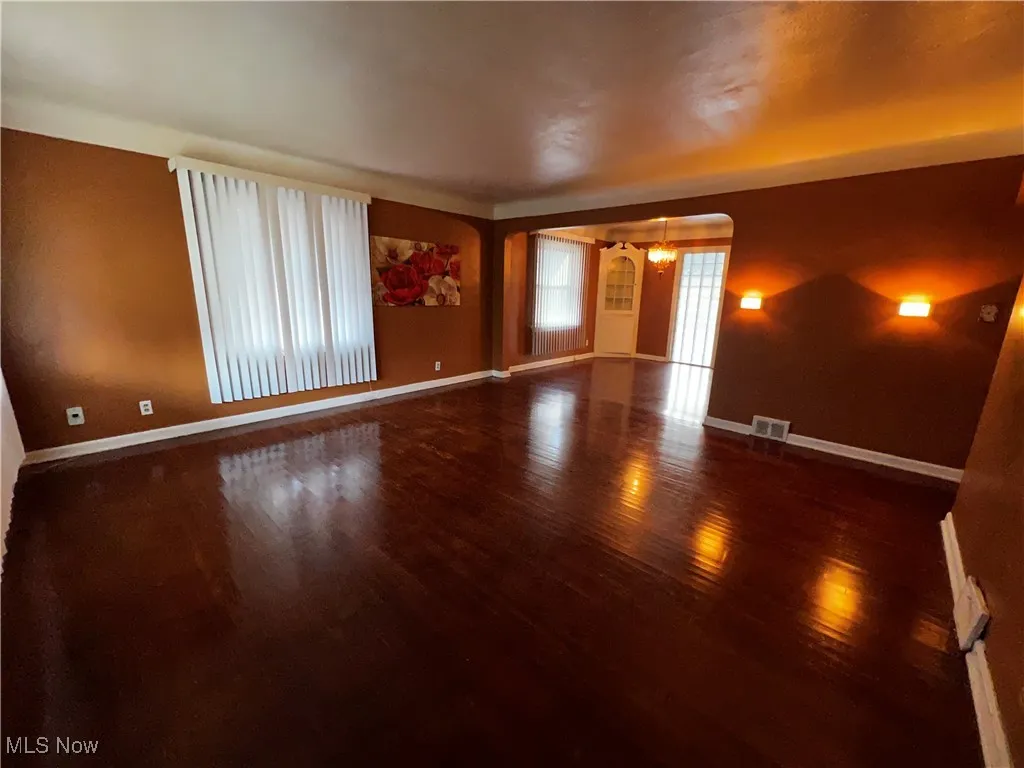 Unfurnished room featuring hardwood / wood-style flooring