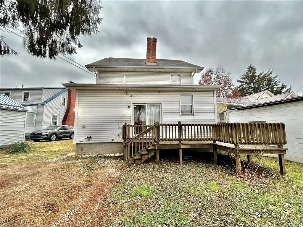 Rear view of property with a wooden deck