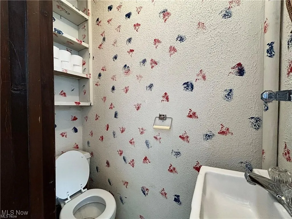 Bathroom featuring sink and toilet