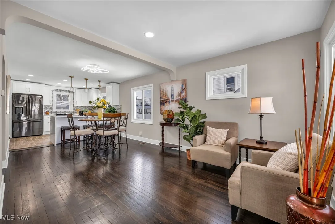 Dining room featuring dark wood-style floors, recessed lighting, and baseboards