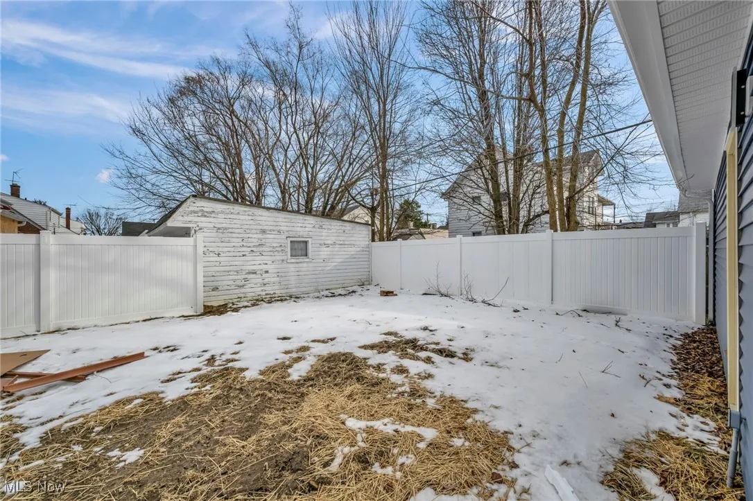 View of yard covered in snow