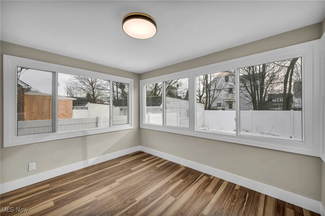 Unfurnished sunroom featuring a wealth of natural light
