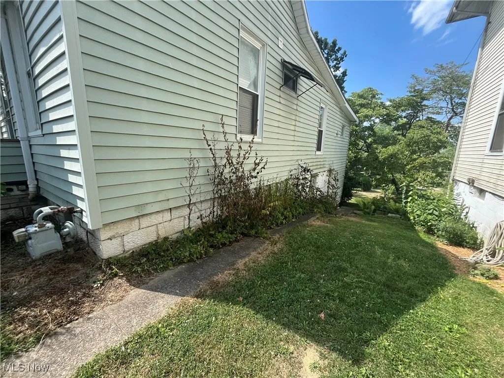 View of home's exterior featuring a lawn
