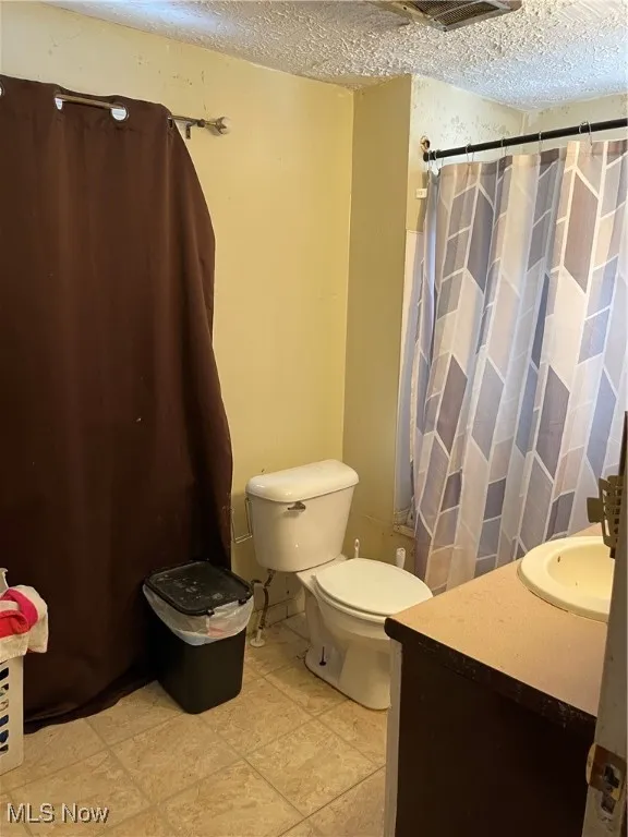 Full bath wih tub and shower combination.  Vinyl flooring