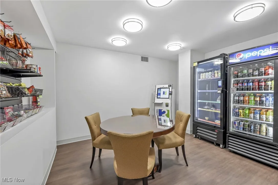 Dining area featuring hardwood / wood-style flooring and wine cooler