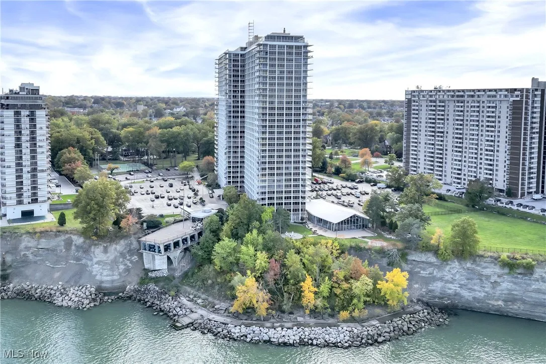 Birds eye view of property with a water view