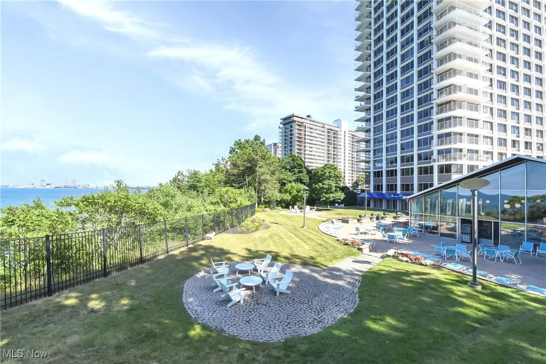 View of community with a lawn and a patio area