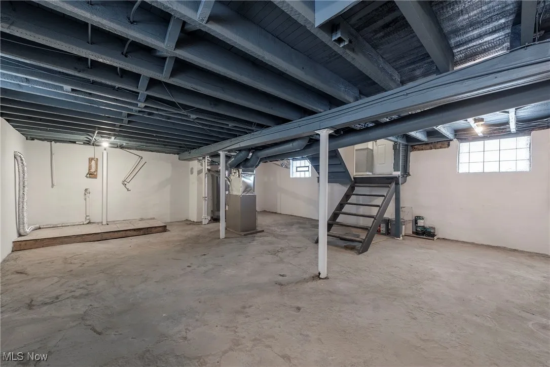 Basement featuring heating unit