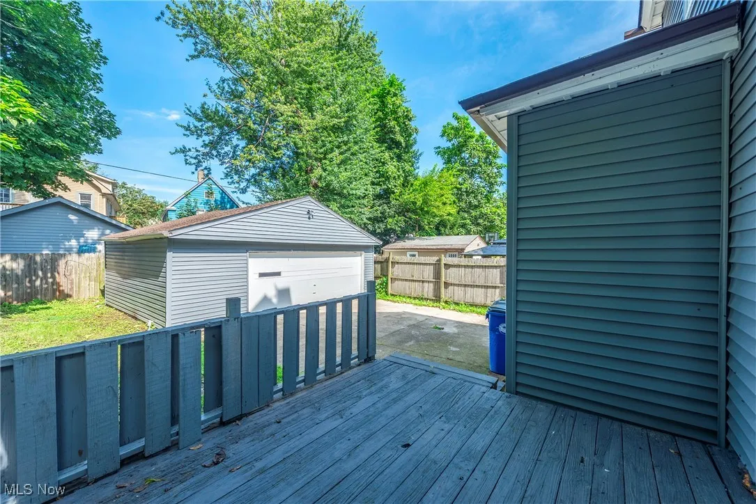 Wooden deck featuring an outbuilding