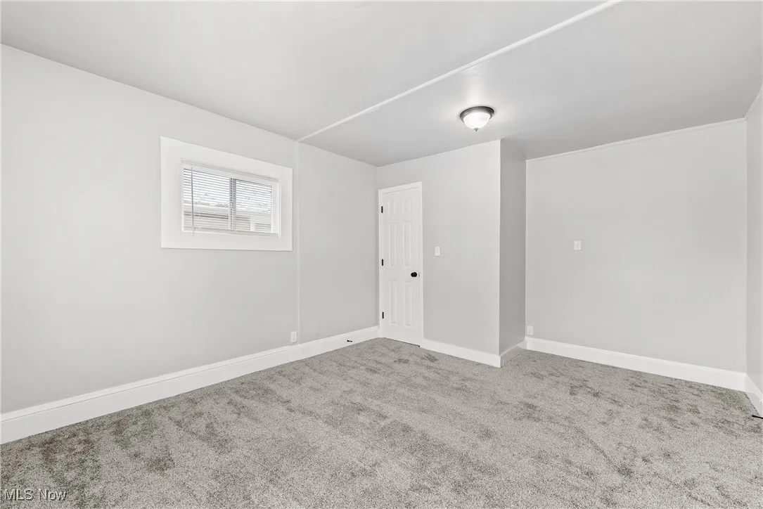 Empty room featuring carpet