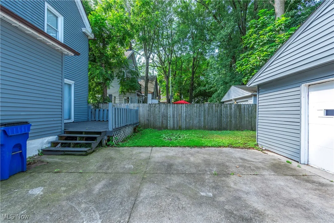 View of patio / terrace with a wooden deck and a​​‌​​​​‌​​‌‌​‌‌​​​‌‌​‌​‌​‌​​​‌​​ garage