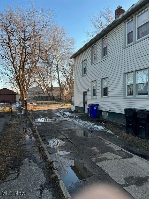 View of side of property with a chimney