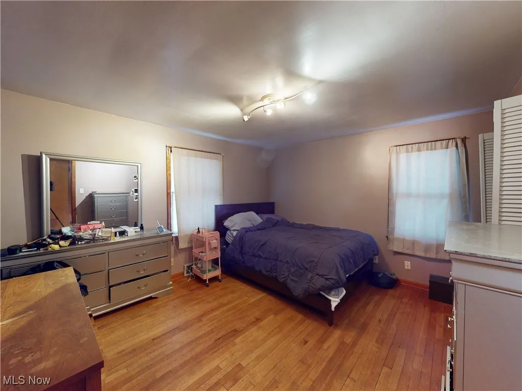 Bedroom featuring baseboards and light wood finished floors