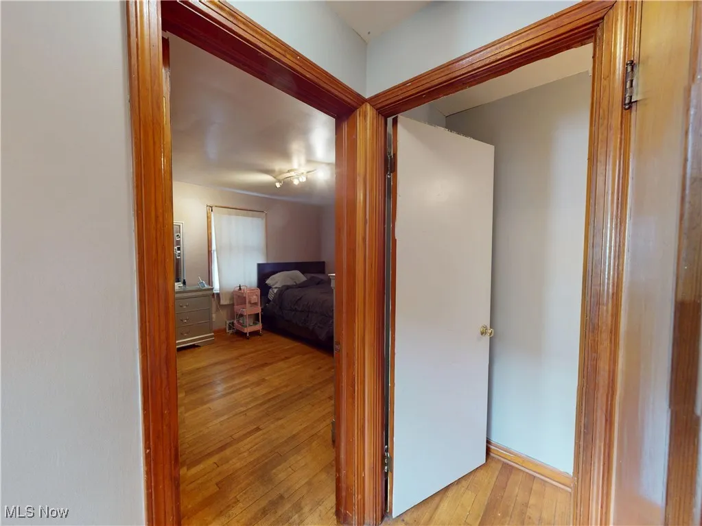 Hallway featuring light wood-style flooring