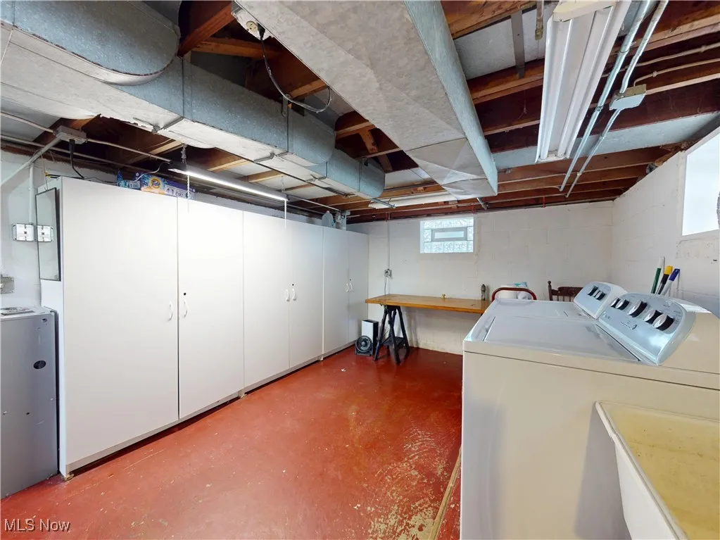 Below grade area featuring separate washer and dryer