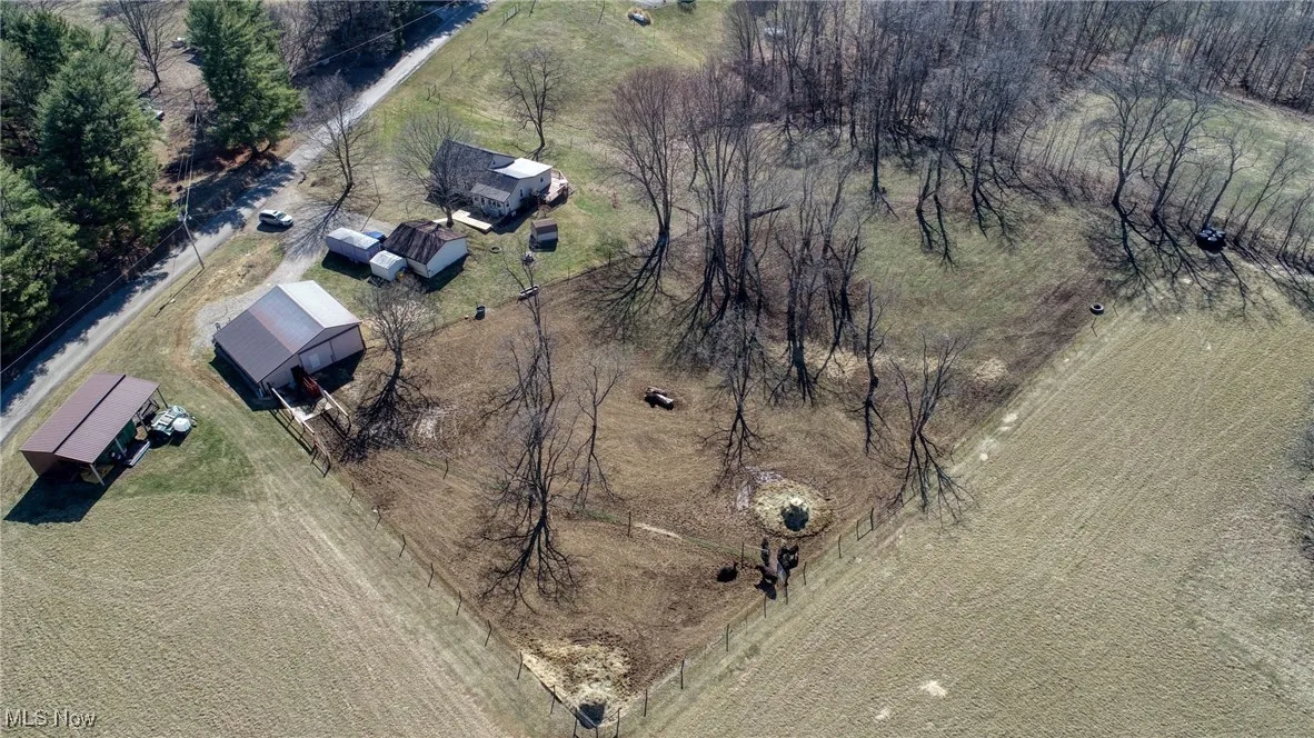 Birds eye view of property featuring a rural view