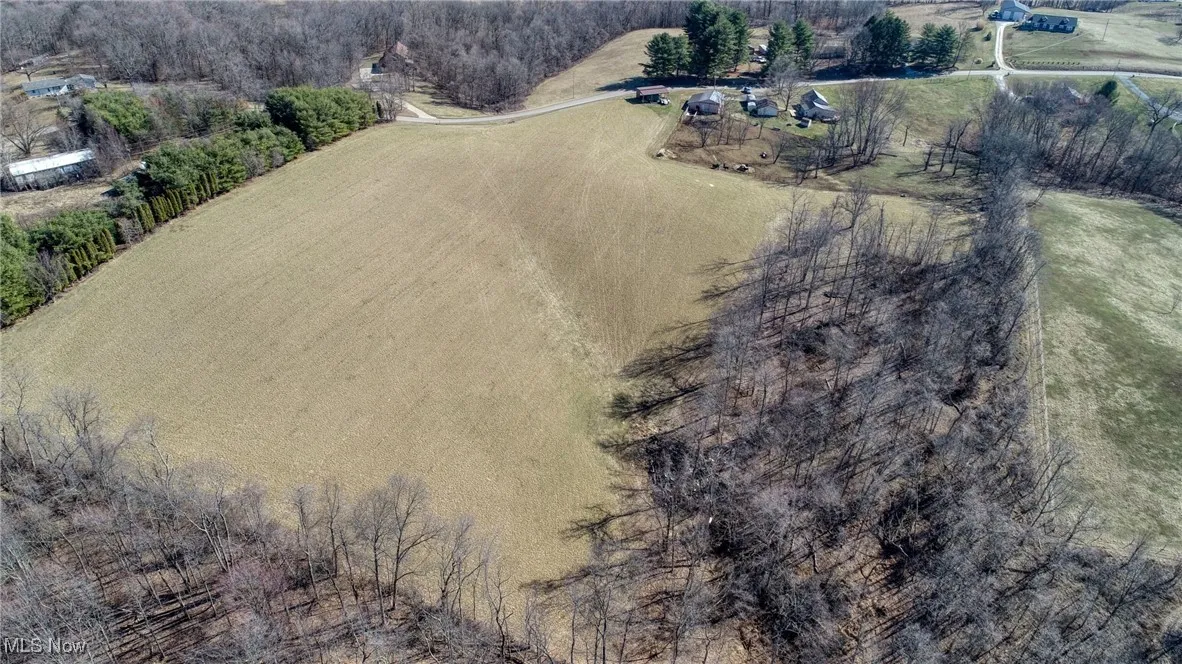 Birds eye view of property with a rural view