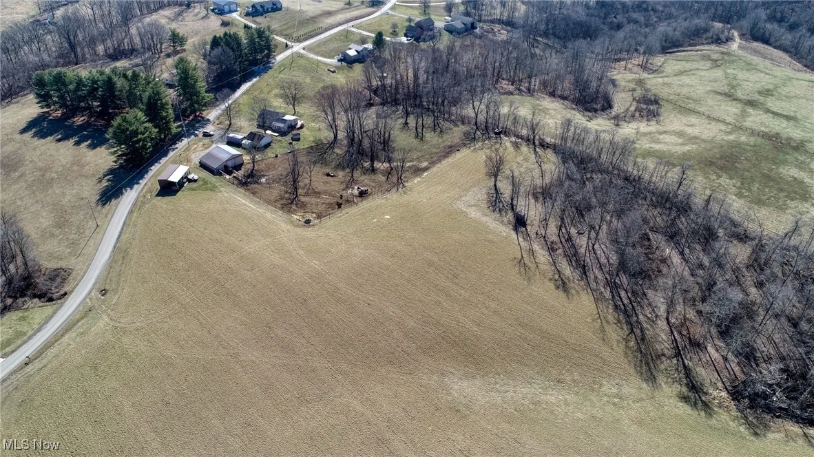Birds eye view of property featuring a rural view